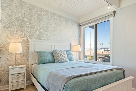 Queen Bedroom Charming and comfortable, the queen bedroom is ideal for restful nights and features a Smart TV, ample storage, and soft, inviting décor.
