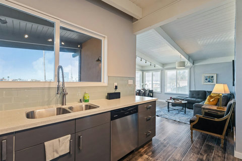 Kitchen Fully equipped with modern appliances and ample counter space, the kitchen invites you to prepare gourmet meals or simple beachside snacks with ease.