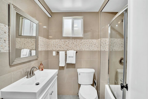 Freshen up in this sparkling clean full bathroom, stocked with fluffy towels and high-end toiletries.