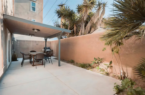 Enjoy al fresco dining on the private patio, complete with a gas grill and seating for 16 - we added a second table to this set up.