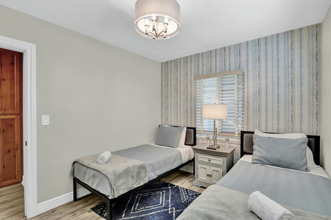 Perfect for kids or extra guests, this bright and airy twin bedroom offers a comfortable space to rest after a long day of beach adventures