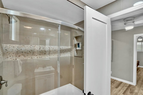 Freshen up in this sparkling clean full bathroom, stocked with fluffy towels and high-end toiletries.
