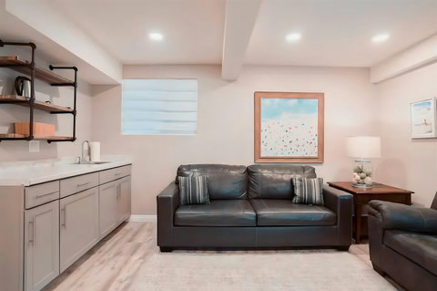 This multi-purpose space is perfect for lounging, watching TV, or setting up a cozy sleeping nook with the sofa sleeper. With direct access to the back patio, it’s ideal for guests who prefer ground-floor accommodations.