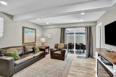This multi-purpose space is perfect for lounging, watching TV, or setting up a cozy sleeping nook with the sofa sleeper. With direct access to the back patio, it’s ideal for guests who prefer ground-floor accommodations.
