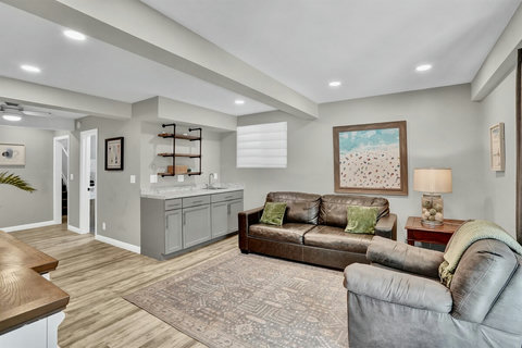 This multi-purpose space is perfect for lounging, watching TV, or setting up a cozy sleeping nook with the sofa sleeper. With direct access to the back patio, it’s ideal for guests who prefer ground-floor accommodations.
