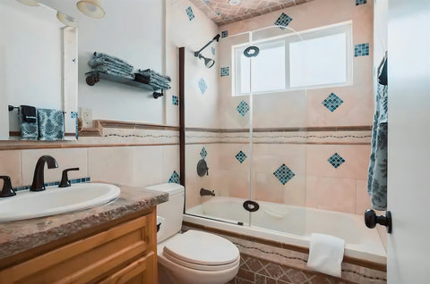 Unwind in the soothing whirlpool tub, a perfect way to end a sun-soaked beach day.
