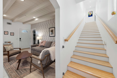 Beautiful staircase leading to the second-floor retreat.
