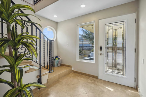 Step into a spacious three-level beach home with a convenient downstairs suite—ideal for multi-gen stays.