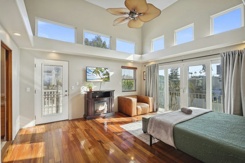 Features an electric fireplace, ensuite bathroom, and spacious walk-in closet.