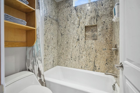 Shower/tub combo in the shared bathroom—great for families.