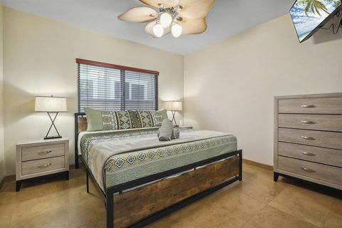 King bedroom on the ground floor with dresser and closet—stay organized and relaxed.