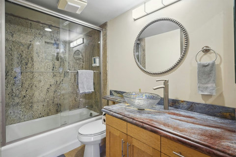 Full bathroom on the ground floor features a shower/tub combo and luxe finishes for added comfort.