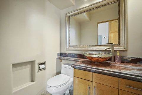 Half bath (powder room) located conveniently off the main living area.