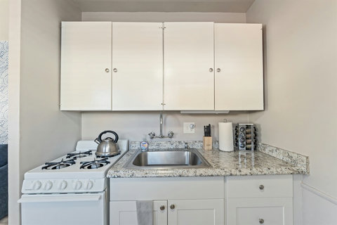 Kitchen with gas range, Full-size refrigerator and plenty of essentials