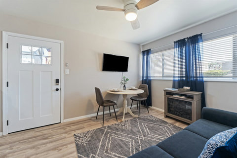 Living Room with Smart TV, Dining Table, Sofa Sleeper