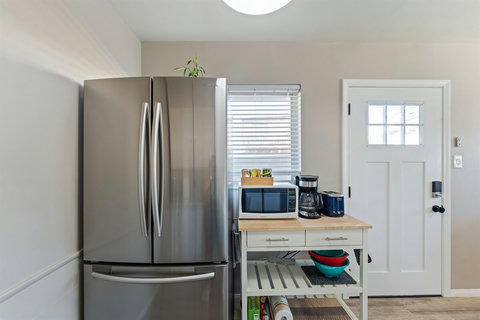 Kitchen with gas range, Full-size refrigerator and plenty of essentials