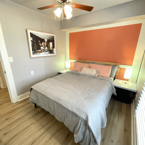 Queen bedroom with bedside lamps and USB charging