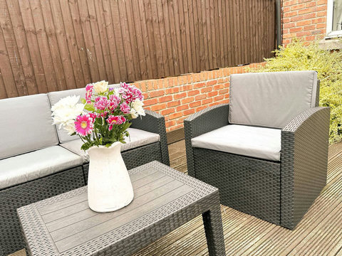 Outdoor space with garden furniture.