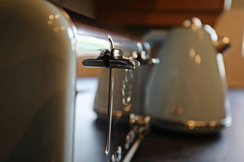 Kitchen featuring oven, hob, fridge-freezer, washer-drier, kettle, toaster, and many other amenities.