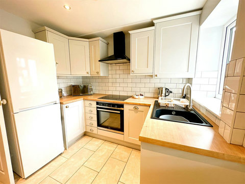Kitchen, fridge-freezer, oven, hob, microwave, washer-drier, dishwasher, table and chairs, etc.