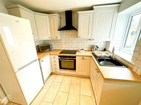 Kitchen, fridge-freezer, oven, hob, microwave, washer-drier, dishwasher, table and chairs, etc.
