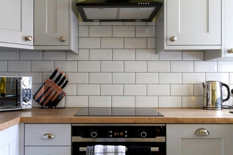 Kitchen, fridge-freezer, oven, hob, microwave, washer-drier, dishwasher, table and chairs, etc.