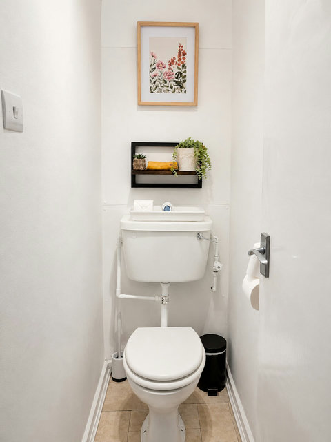 Separate toilet area within the bathroom, kept clean and stocked with essential toiletries for your stay.