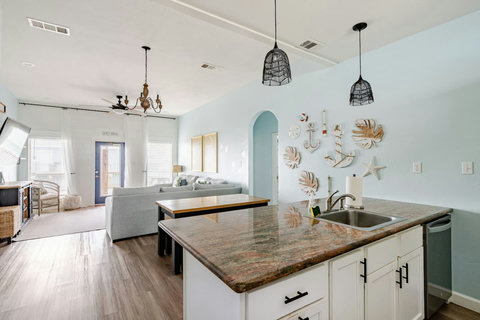 Kitchen island looks out over the living room
