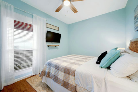 Queen bed and wall TV