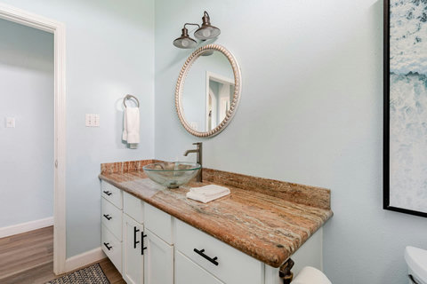 Granite vanity with a glass vessel sink
