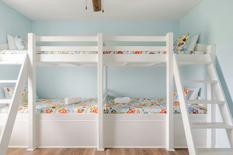 Four bunks with colorful beach bedding