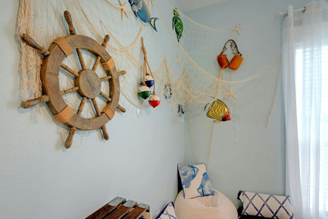 Nautical decor and bean bags in the bunk room