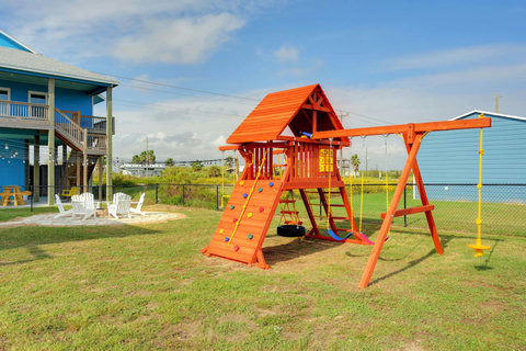 Playscape with swings, slide and climbing wall