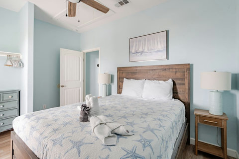Queen bed with a rustic wood headboard