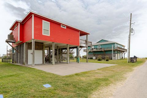 Drive-up parking under and beside the house