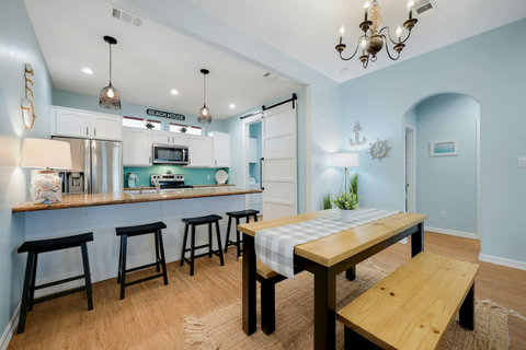 Farmhouse dining table and bar seating by the kitchen