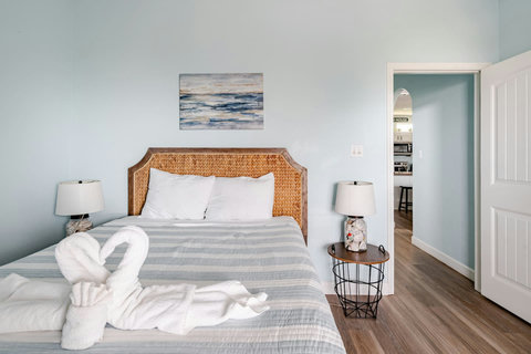 Queen bed with soft striped bedding