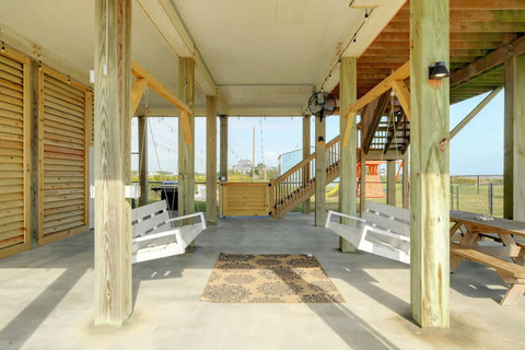 Porch swings in the shade under the house