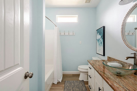 Bright bath with a tub and shower