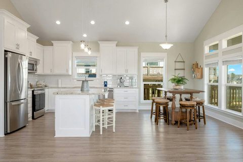 Kitchen with bar stools and a high-top table