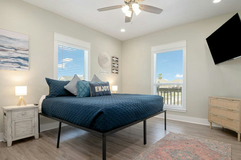 King bedroom with a TV