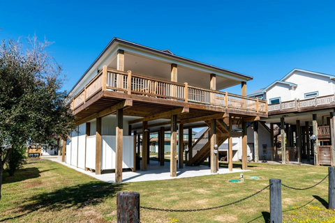 Stairs up to the deck from the shaded patio