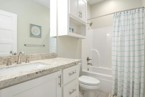 Hall bath with a tub-shower
