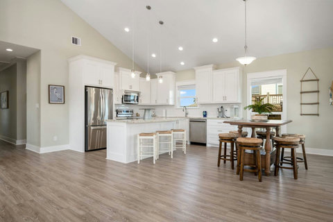 Kitchen island and dining table by the windows