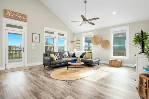 Leather sectional and plenty of natural light