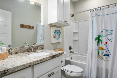Hall bath with a tub-shower