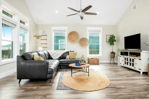 Living room with a smart TV and coastal decor
