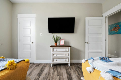 Bedroom with a TV and dresser