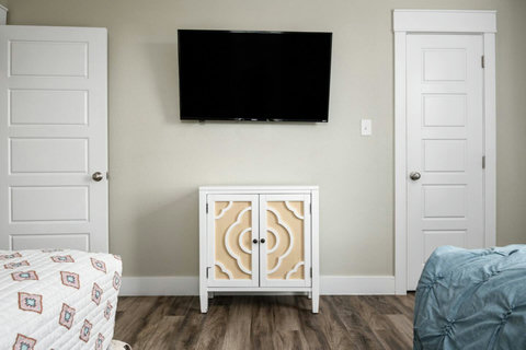 Bedroom with a TV and cabinet