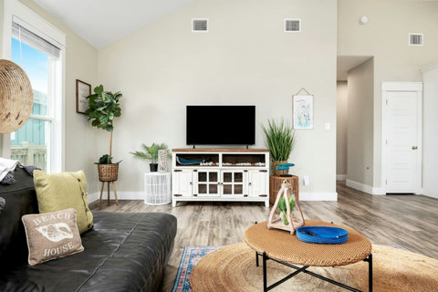 Living room with a hallway to the bedrooms